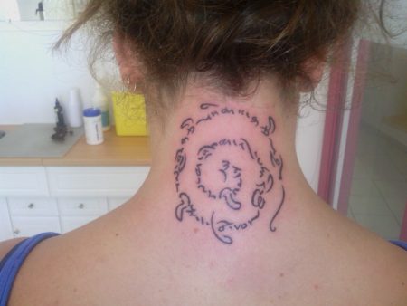 cursive spiral tattoo
